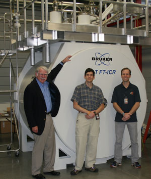 Pictured with the Bruker 21 Tesla FT-ICR magnet at the NHMFL lab are (from left to right): Professor Alan Marshall, the Robert O. Lawton Professor of Chemistry and Biochemistry at Florida State University and Director of the High Field FT-ICR program at the NHMFL; John Quinn, 21 T FT-ICR engineering lead at NHMFL; Dr. Chris Hendrickson, 21 T FT-ICR project advisor at the NHMFL.